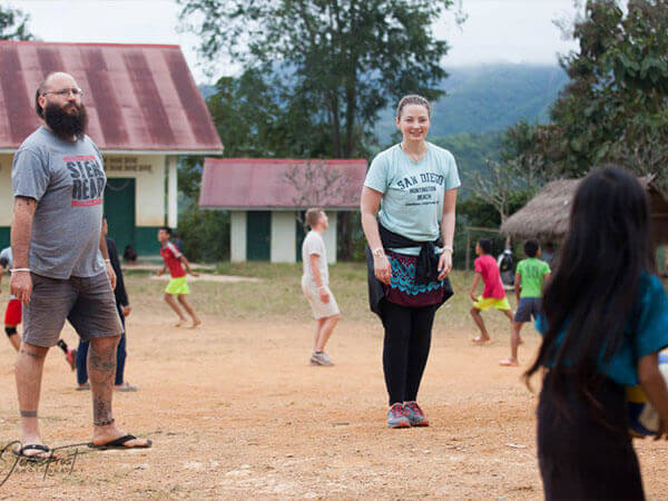 Adults and children on soccer field